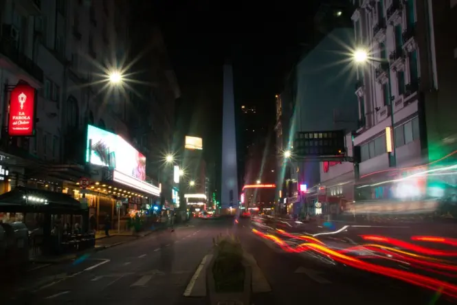 Crowds gathered at the Obelisk of Buenos Aires during a nighttime celebration