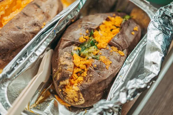 Kumpir baked potato loaded with toppings at an Ortaköy street stall