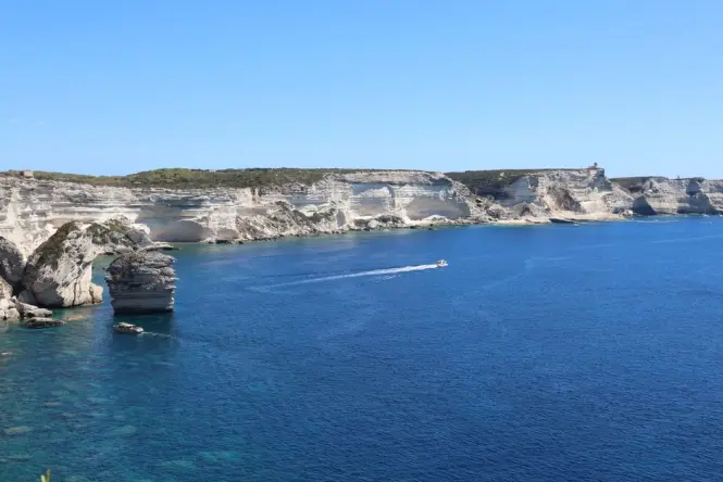 Boat touring the cliff coastline near the Calanques