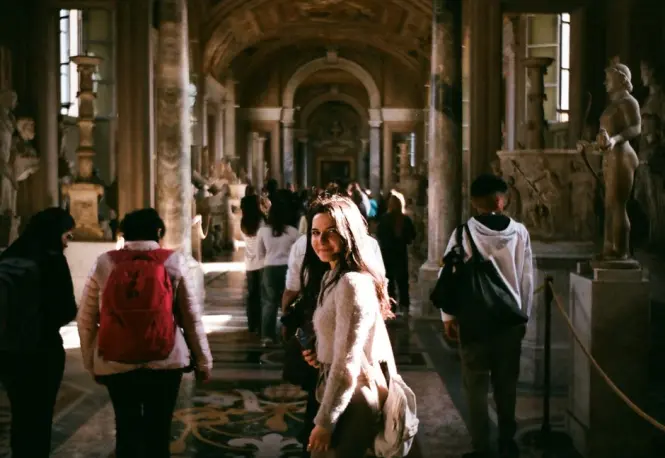 Visitors walking through the reconstructed passage of the Ishtar Gate