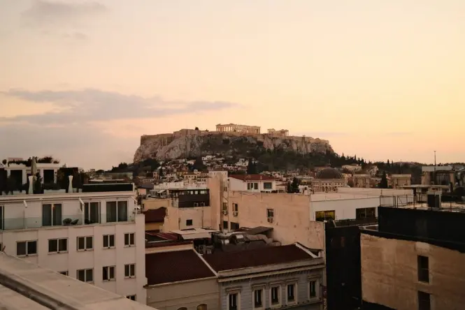 Golden hour sunset view of the Acropolis from Philopappos Hill terrace