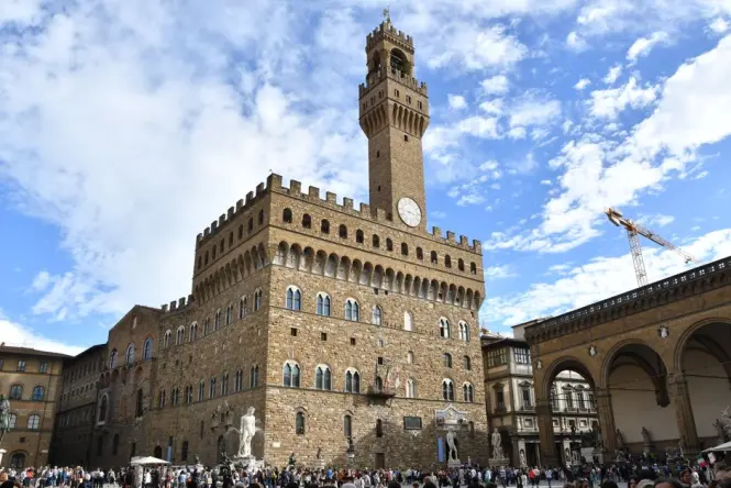 Tourists exploring Piazza della Signoria during the morning
