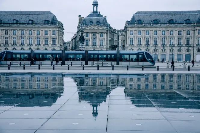 Tram passing near Place de la Bourse