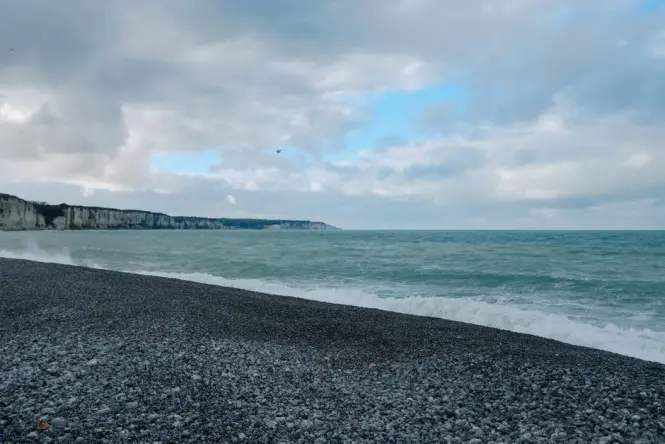 Coarse sand and pebbles at the shoreline of a French Riviera beach