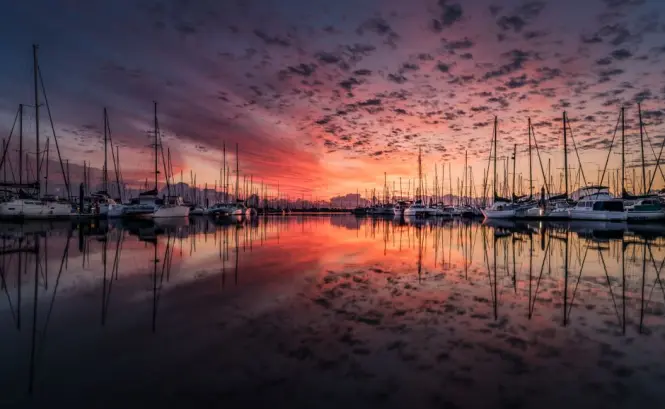Sunset over boats in Nice harbour