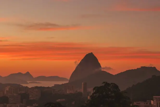 Sunset light on Sugarloaf Mountain seen from Praia Vermelha beach