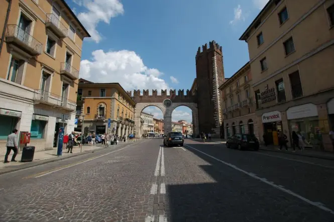 Close-up view of the historic red-brick Roman towers of Porta Palatina