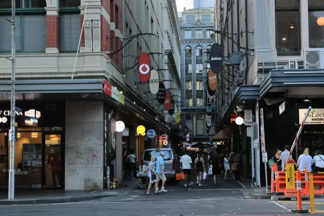Shoppers walking through the Queen Victoria Building arcade during the day