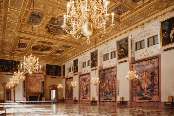 The massive marble Citizens Hall inside the Royal Palace Amsterdam with floor maps and Atlas statue