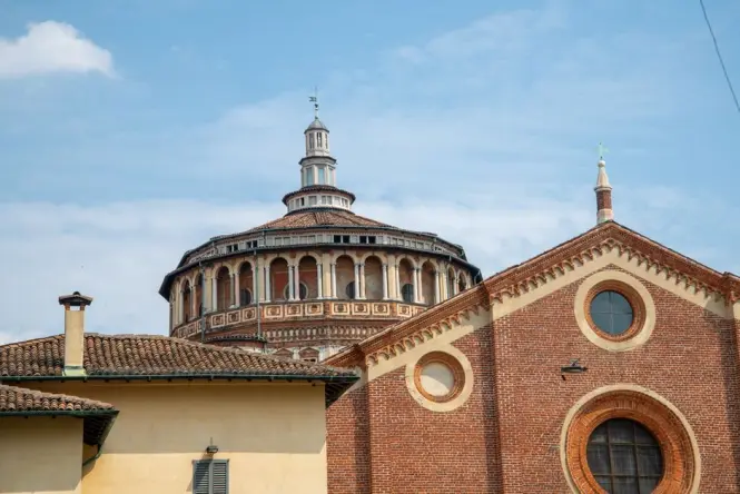 Visitors standing outside the modern ticket office next to Santa Maria delle Grazie
