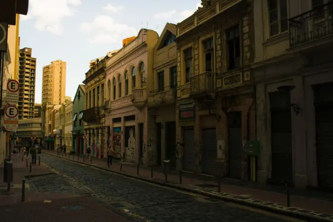 Cobblestone street lined with colonial houses in Santa Teresa at dusk