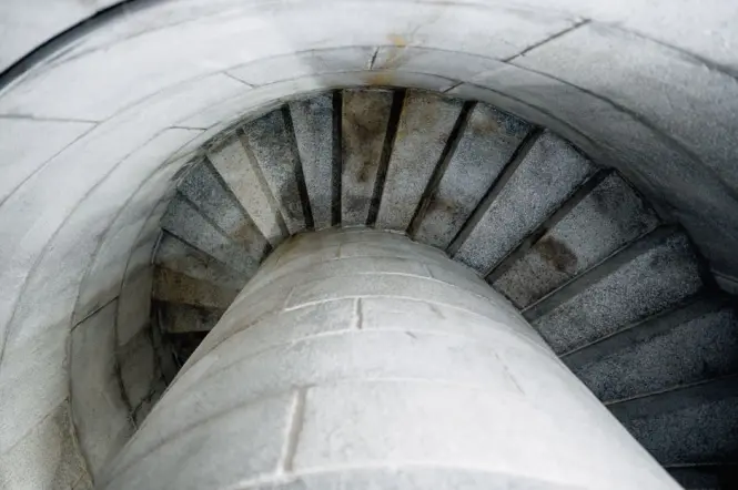 The tight spiral stone staircase inside Scott Monument leading to the upper platforms