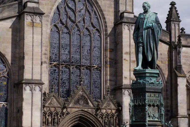 John Steell's marble statue of Sir Walter Scott seated at the base of the monument