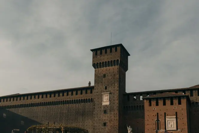 The empty front courtyard of Sforza Castle in the quiet morning light
