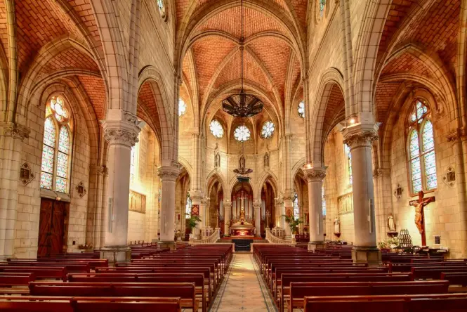 Vaulted nave and wooden altar inside St. Joseph's Cathedral Hanoi