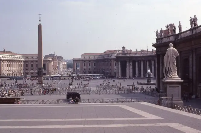 Piazza San Pietro seen from above with morning crowds gathering
