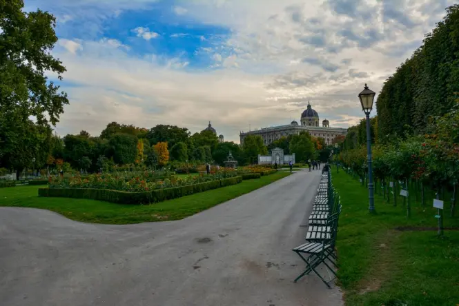 Quiet tree-lined path in Stadtpark Vienna on an autumn morning