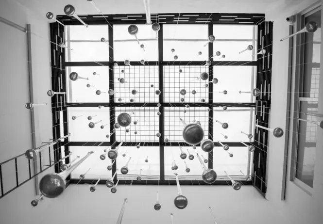 Mirrored art installation with suspended spheres