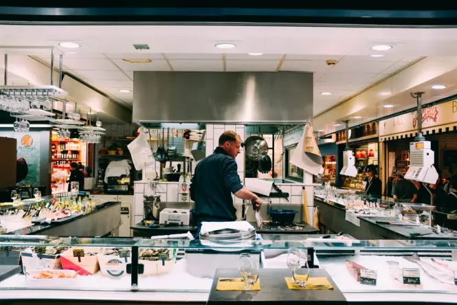 Food counters and dishes at Time Out Market Lisbon