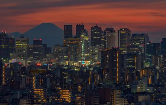Mount Fuji visible beyond Tokyo skyline on a clear winter day