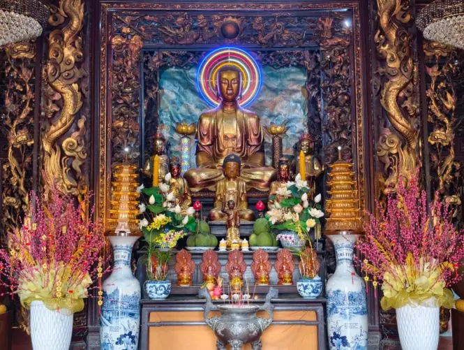 Incense smoke rising near the main altar hall inside Tran Quoc Pagoda