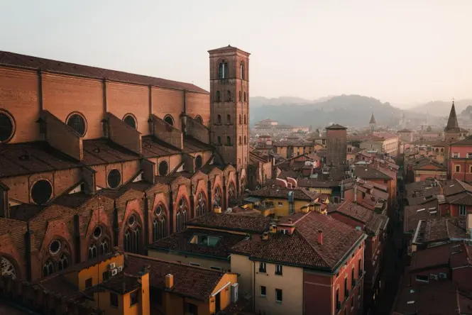 A low-angle view highlighting the brickwork and lean of the Due Torri
