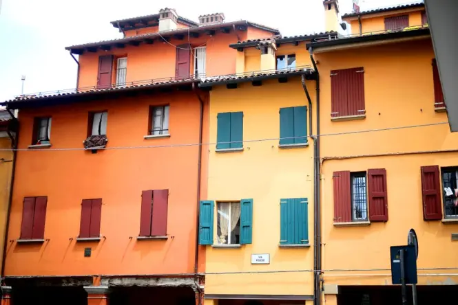 The Two Towers visible from the historic porticos of Via Rizzoli in Bologna