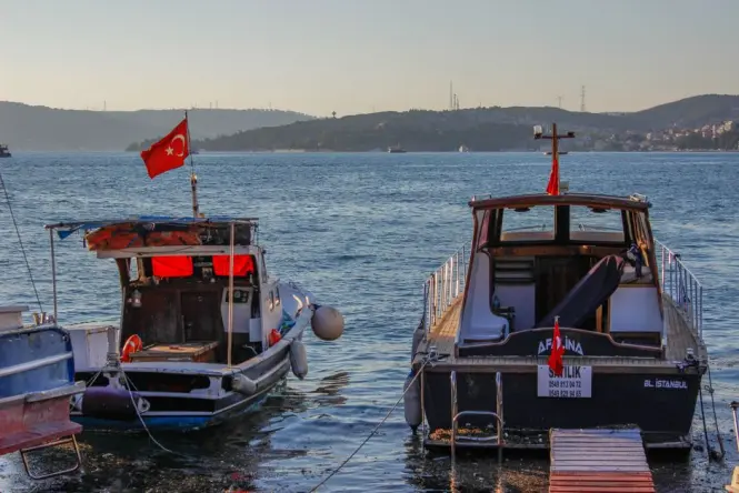 Early morning light over fishing boats in a small Mediterranean harbour