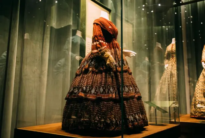 Couture garments displayed inside the Yves Saint Laurent Museum permanent gallery