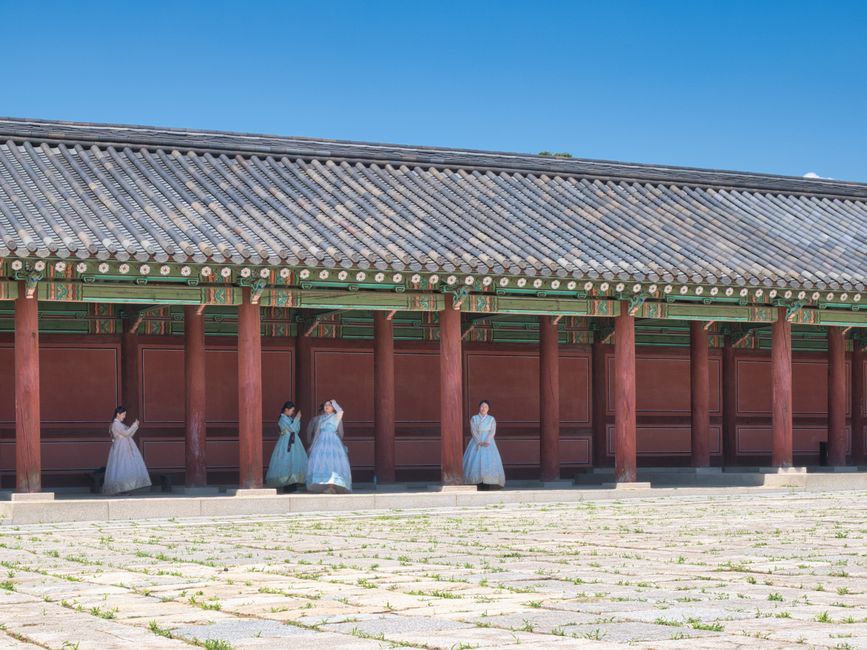 Gyeongbokgung Palace with visitors in hanbok