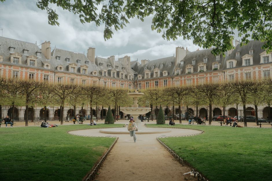 Place des Vosges gardens and red-brick arcades
